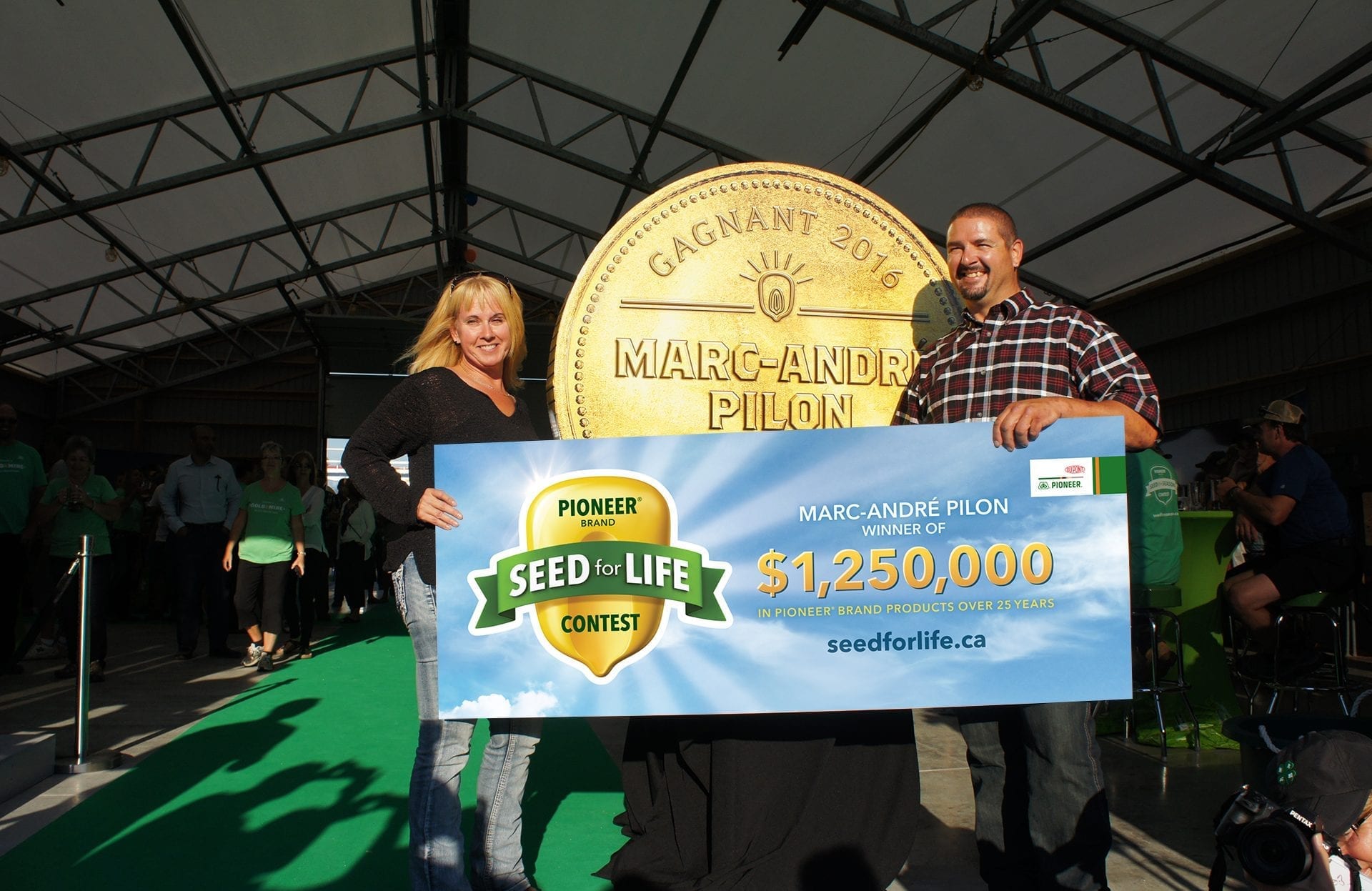 DuPont Pioneer Seed for Life grand prize winner coin and banner